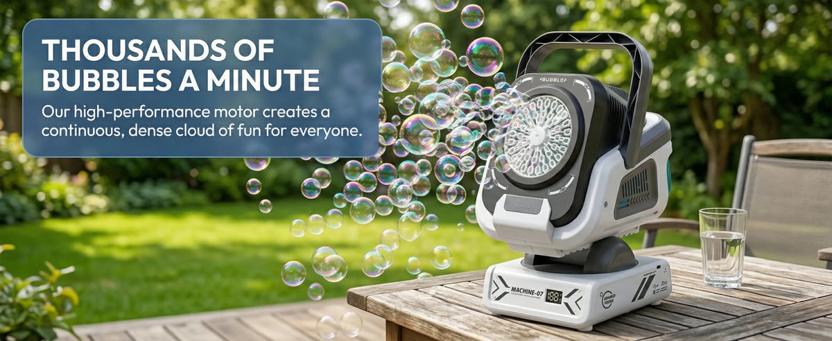 A white bubble machine is shown on a wooden table, creating a dense cloud of bubbles in a green outdoor setting.