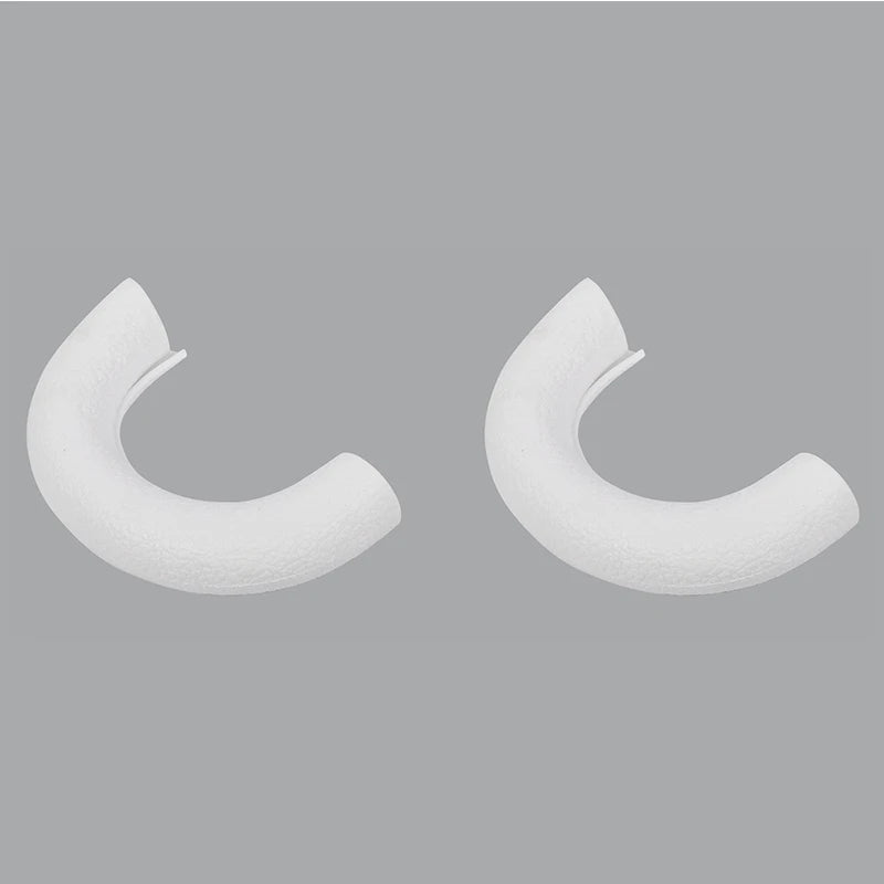 A pair of white TPE front bumper tow hook covers for a Ford F-150.