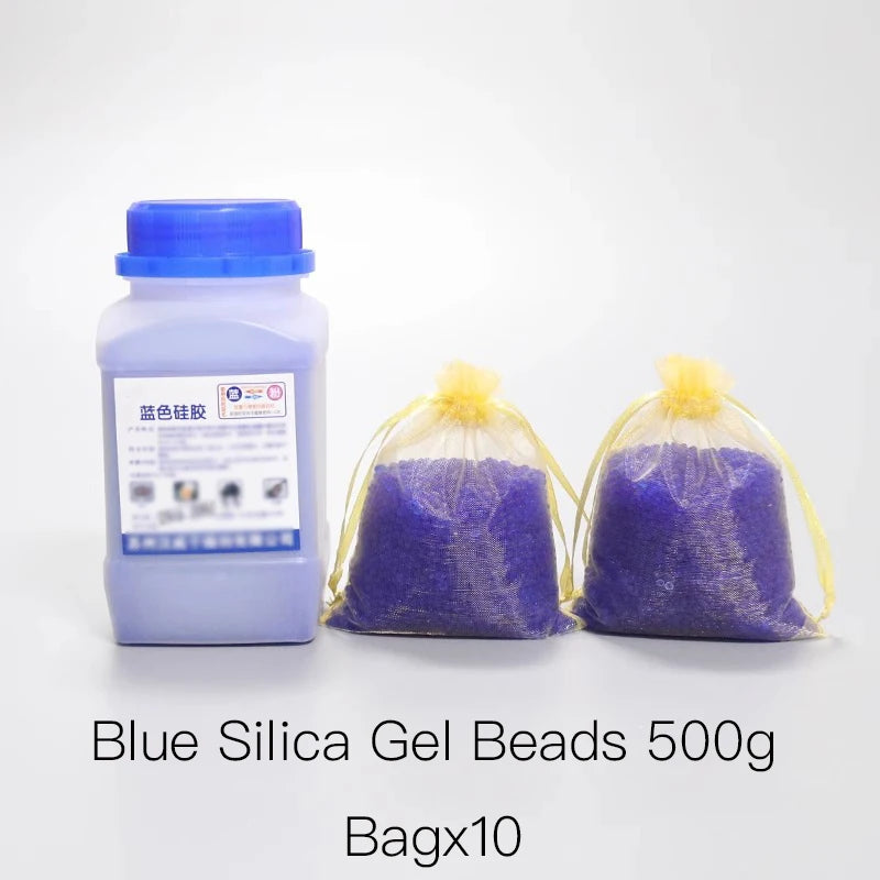 A bottle of blue silica gel beads next to ten sealed bags of purple silica gel beads.