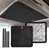 Black and silver foldable sunshade covering an RV skylight window.