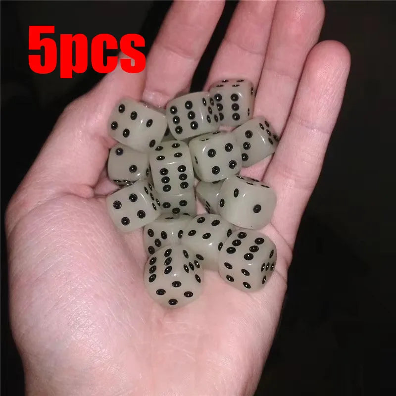 Five glow-in-the-dark acrylic dice set held in a hand for night games