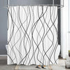 A white shower curtain featuring abstract black, flowing geometric lines against a white background.