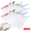 A set of ten white foaming mesh bath poufs with colored hanging loops
