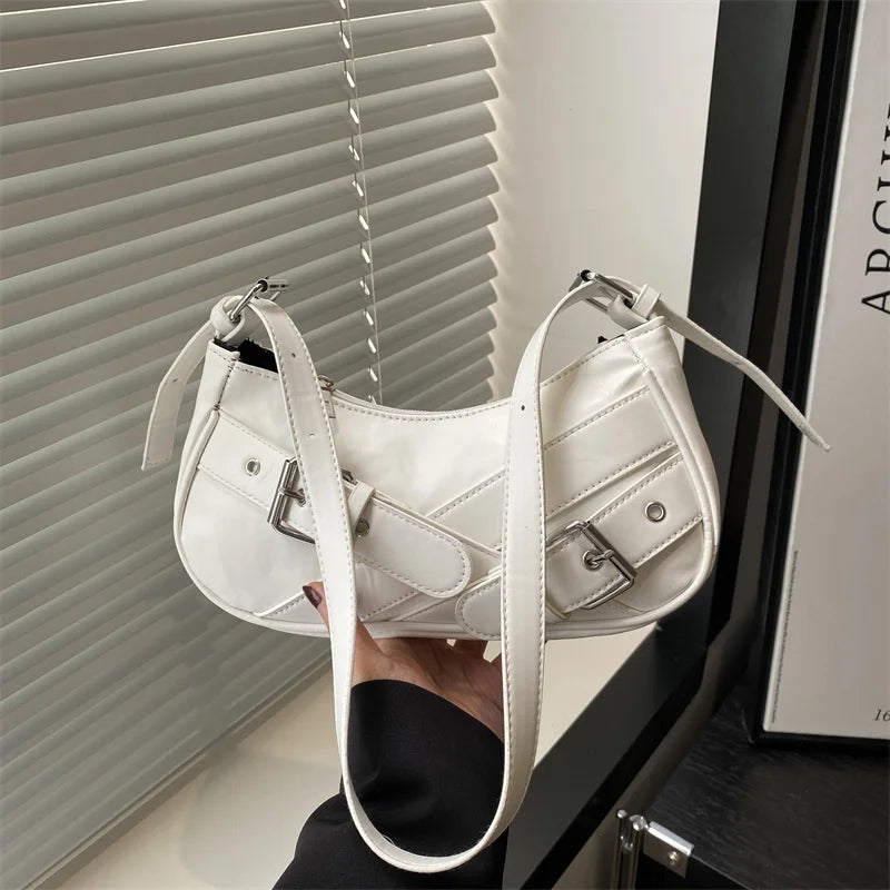 A white Y2K vintage PU leather crossbody bag is displayed against a window blind.
