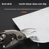 Close-up of heavy-duty aviation snips cutting a sheet of white paper.