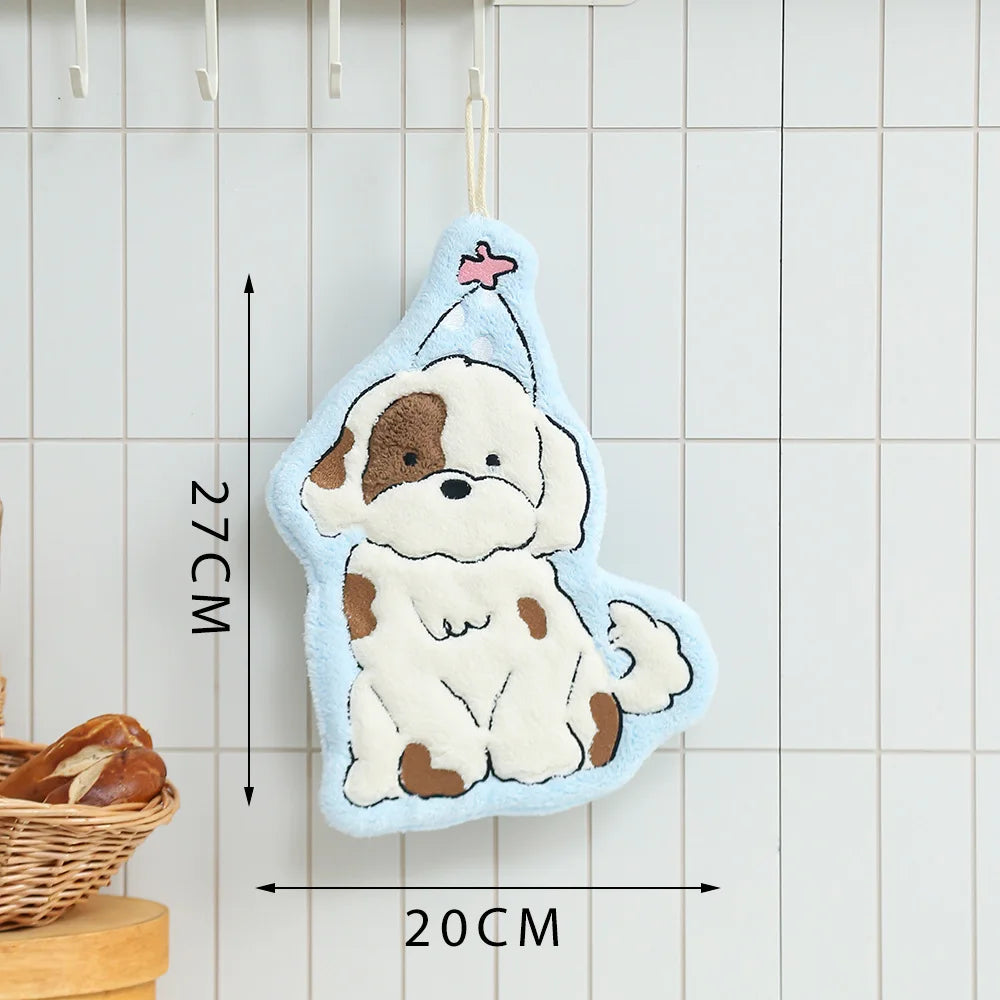 A light blue cartoon dog hanging towel with a pink star detail, displayed against a white tiled background.
