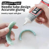 Hand applying B-70 adhesive glue to a needle tube design for jewelry repair