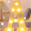 A letter night light shaped like the letter A made of glowing yellow LED lights