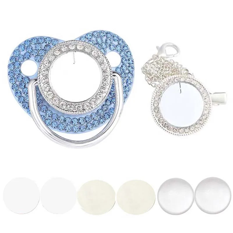A set of sparkling rhinestone pacifiers with clips for babies, featuring blue and clear accents.