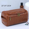 A brown PU vintage luxury toiletry bag with gold hardware is shown next to a bottle and a small grooming tool.