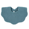 A soft teal knitted baby bib in a bandana style with a cutout for the baby's neck.