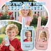 Two pink walkie talkies with HD cameras being held by happy children outdoors