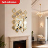 A decorative, gold-framed Moroccan-inspired mirror is mounted on a white wall above a fireplace mantel.
