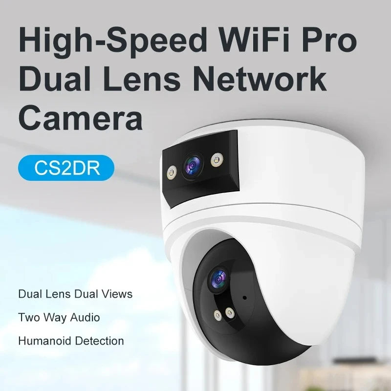 Cámara de seguridad WiFi Pro de doble lente blanca con carcasa negra, visible en interiores.