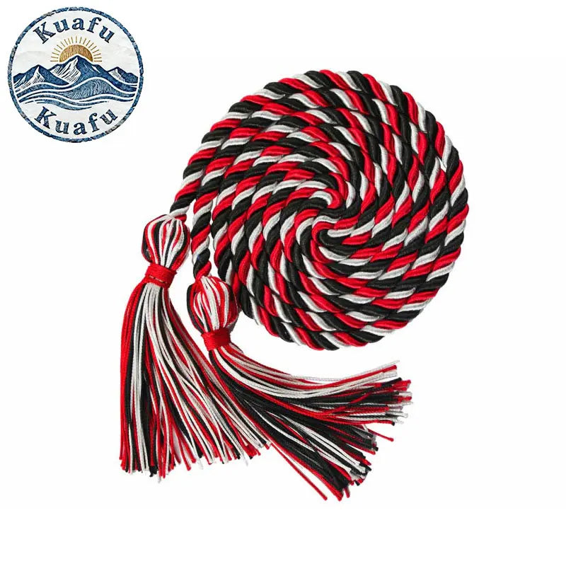 A spool of red, black, and white graduation honor cords with tassels for ceremonies and crafts.