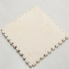 A square mat of soft, cream-colored plush interlocking floor tiles.