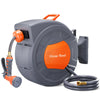 A gray wall-mounted garden hose reel with an orange nozzle and coiled black hose.