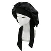 Black satin sleep cap for hair protection displayed on a mannequin.