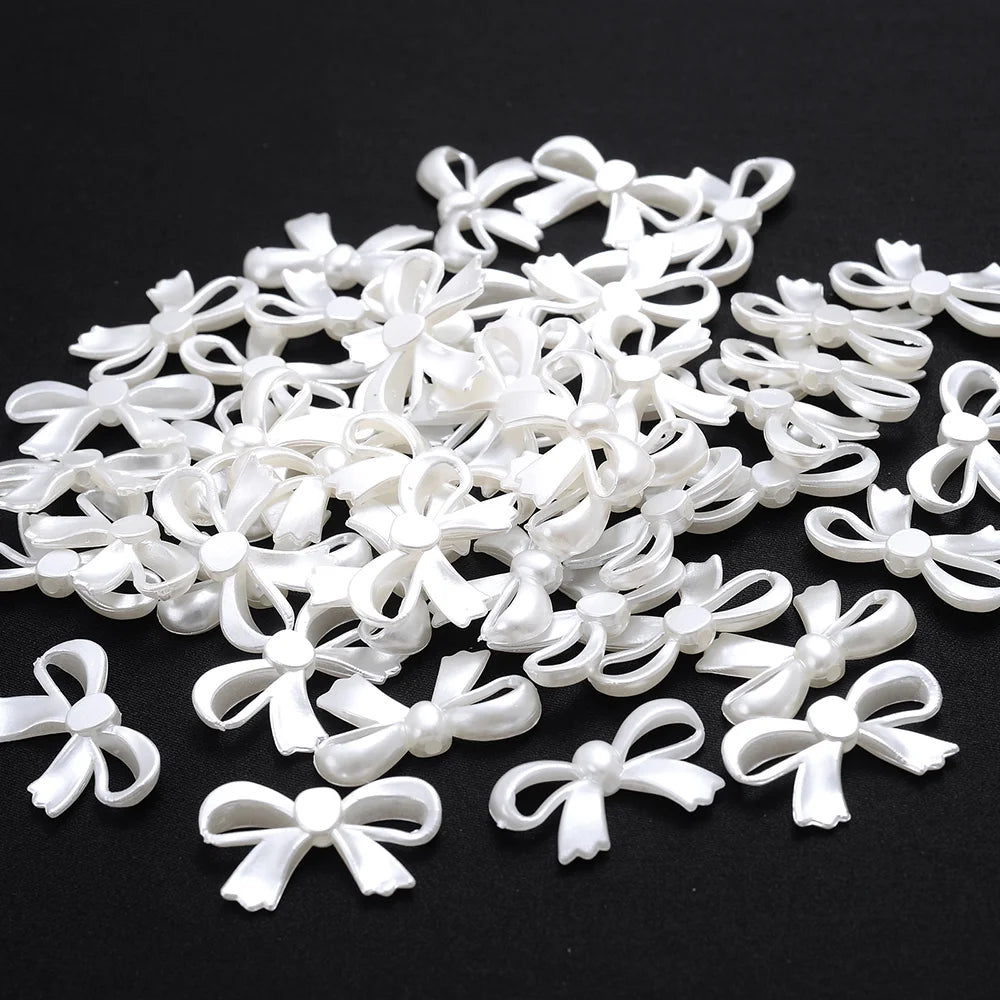A pile of 100 white acrylic pearl spacer beads for jewelry making