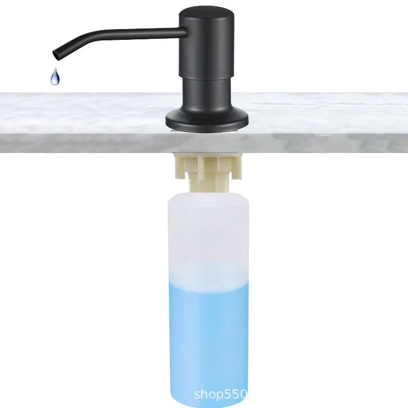 A black stainless steel pump liquid soap dispenser with a clear blue bottle underneath.