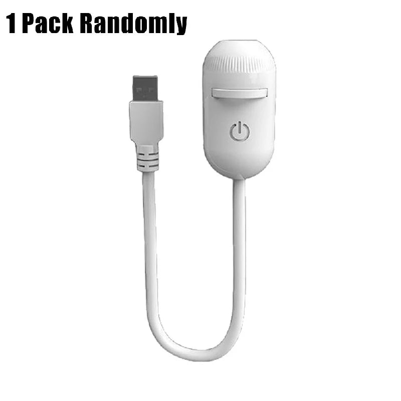 A white mini projector night light with a plug and flexible cord is shown.