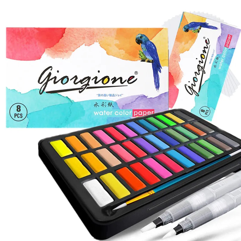 A watercolor paint set featuring colored paper and brushes displayed in a black metal case.