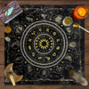 A dark fabric featuring a gold-on-black zodiac chart and tarot symbols for mystical readings.