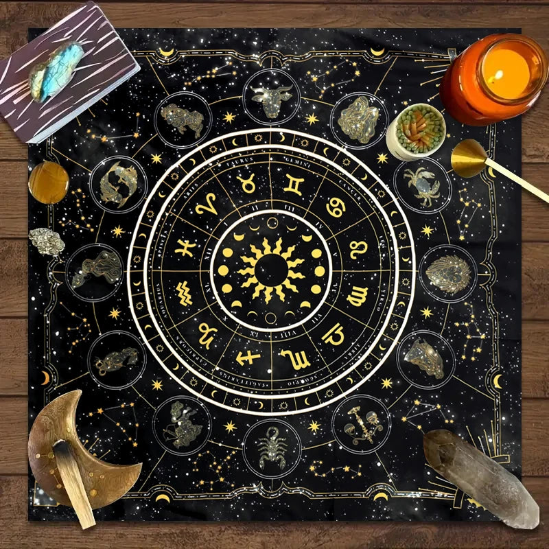A dark fabric featuring a gold-on-black zodiac chart and tarot symbols for mystical readings.
