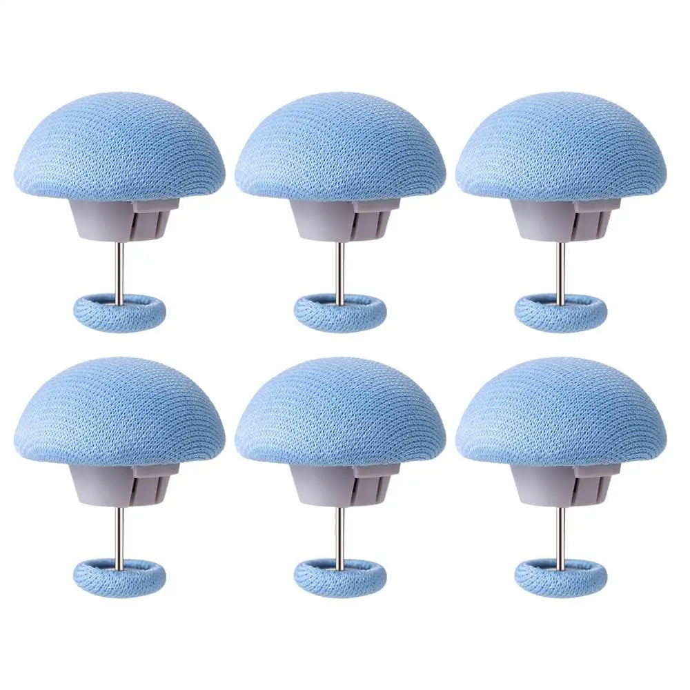 A set of six light blue non-slip duvet cover clips with dome-shaped heads and metal stands.