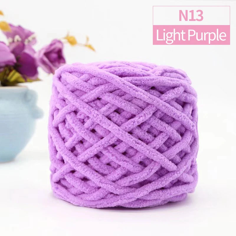 Purple chunky chenille yarn skein used for knitting and crochet projects