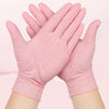 A pair of pink nitrile gloves are shown, folded and held together, against a light pink background.
