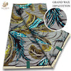 Gray fabric with a pattern of black, yellow, and bright blue feathers, sold as Grand Wax 100% cotton.