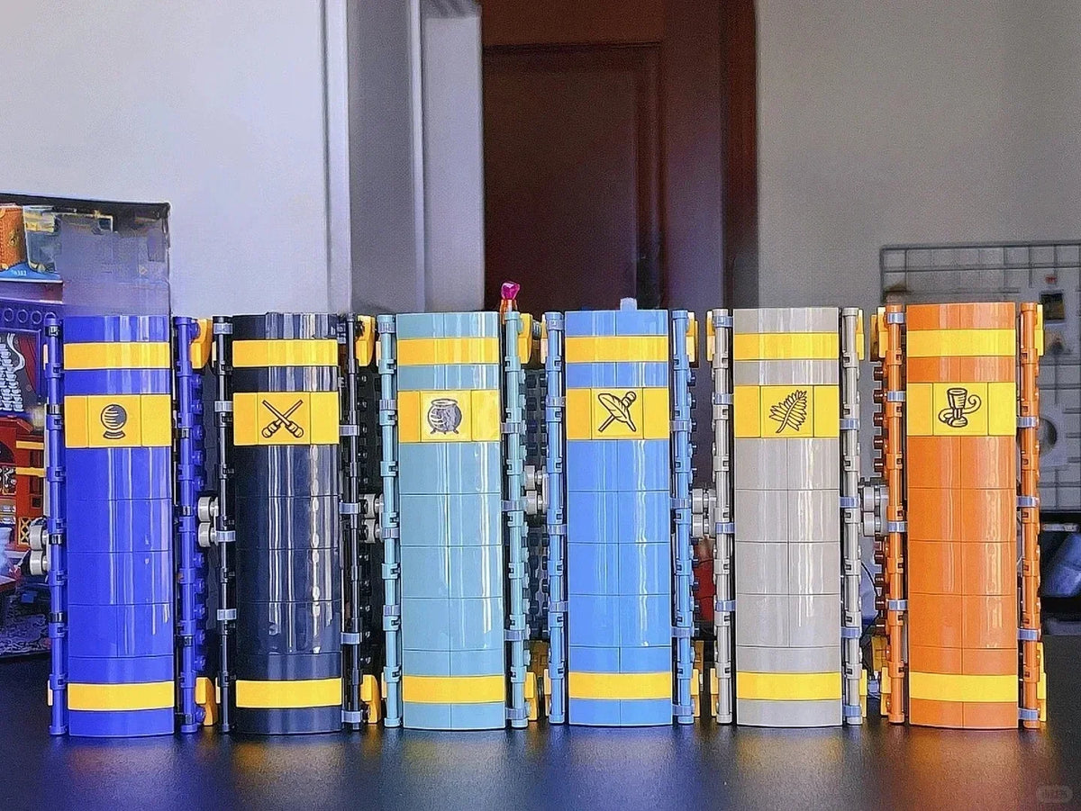 A display of six fantasy theme building blocks in various colors including blue, black, light blue, yellow, and silver.