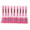 A row of pink insulated waterproof heat shrink butt connectors for 22-16 AWG wires.
