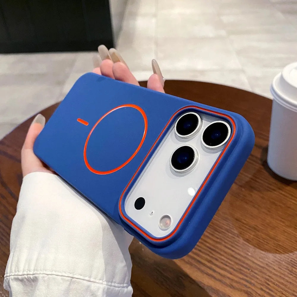 A hand holds a blue Magnetic Matte phone case with MagSafe support on a wooden table.