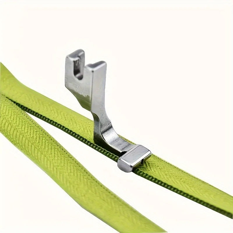 Stainless steel invisible zipper presser foot for sewing machines shown against a lime green fabric.