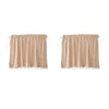 A pair of brown and tan checkered sun shade curtains with lace trim.