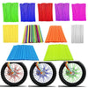 A collection of colorful cylindrical wraps and a set of motorcycle wheel spoke covers.