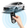 A hand holds a black TPU car key cover, demonstrating its proximity sensor function near a Mazda vehicle.