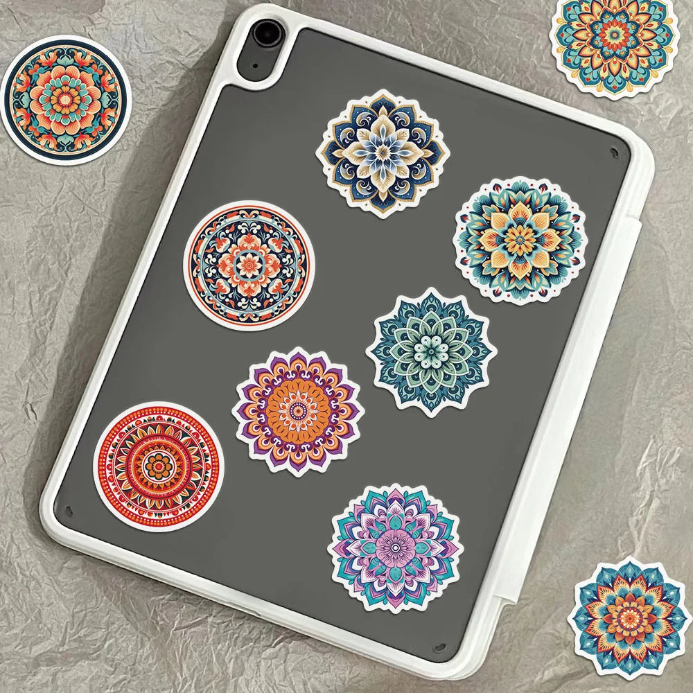 A gray phone case features several colorful mandala and graffiti stickers in various sizes and patterns.