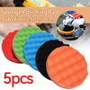 A set of five colored foam polishing pads for car detailing, including red, green, blue, black, and orange.