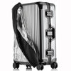A silver suitcase with a transparent waterproof cover and black accents, shown from the side.