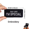 Black embroidered patch that says Dad Says I'm Special with dimensions listed.