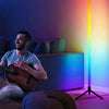 An LED RGB dreamcolor floor lamp illuminates a room with vibrant light and sound reactive ambient lighting.