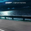 A blue car drives on a road with bright headlights at dusk, featuring Fahren LED lights.