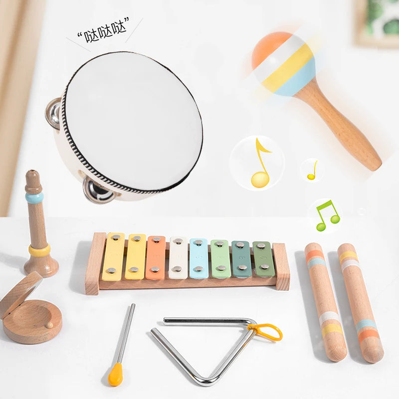 A wooden percussion instrument set for kids showing a mirror, various wooden sticks, and a metal tuning tool.