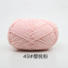 A ball of soft pink 4-ply milk cotton yarn for knitting and crochet.