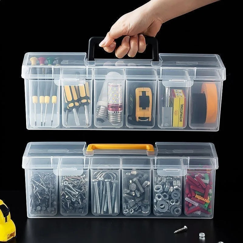 A hand is holding a clear multi-compartment tool organizer storage box with various tools inside.