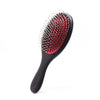 A black hair brush with red bristles and a black handle for detangling and scalp massage.