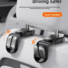 A close-up of a foldable hidden hook mechanism attached to a car seat headrest.